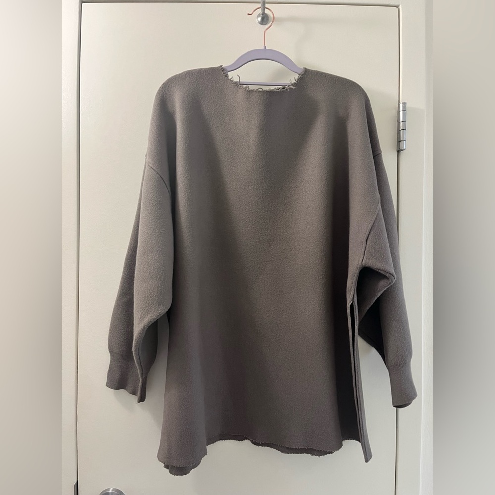 Oversized knit sweatshirt with distressed elements. Size XS.